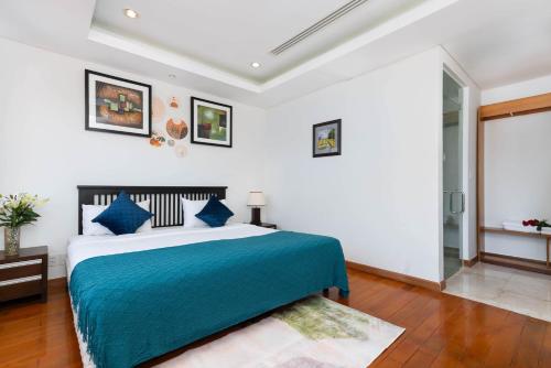 Ένα ή περισσότερα κρεβάτια σε δωμάτιο στο Ocean Sunny Villas Da Nang
