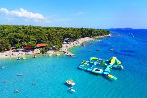 an aerial view of a beach with a water slide at Mobile Homes Jaki - 2 Bathrooms, Large Terrace in Biograd na Moru