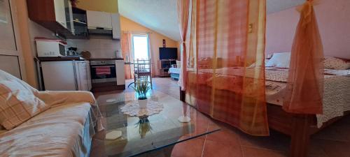 a living room with a couch and a table at Apartments Villa Bella Vista Hvar in Hvar