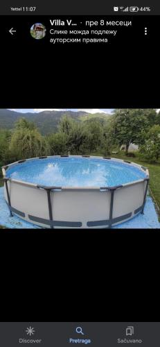 a boat sitting on top of a field at Vila VRABAC in Priboj