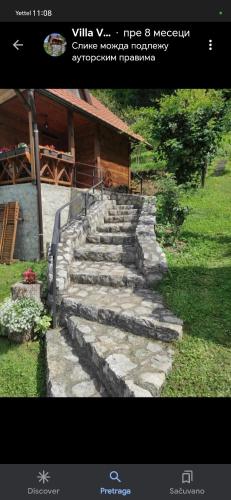 a group of stone stairs in front of a building at Vila VRABAC in Priboj