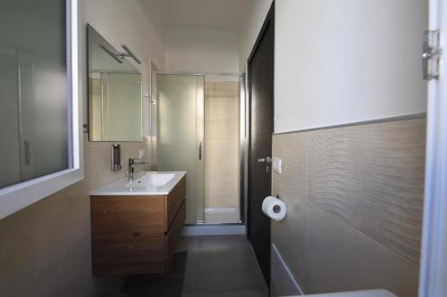 a bathroom with a sink and a mirror at AL Quadrifoglio in Terrasini