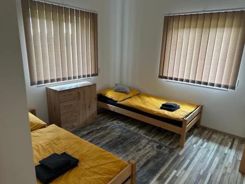 Ένα ή περισσότερα κρεβάτια σε δωμάτιο στο Kehida Relax Apartmanház