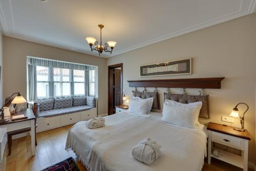 Postel nebo postele na pokoji v ubytování Akanthus Hotel Ephesus