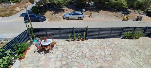 an overhead view of a table and chairs and a car at Apartments Villa Bella Vista Hvar in Hvar