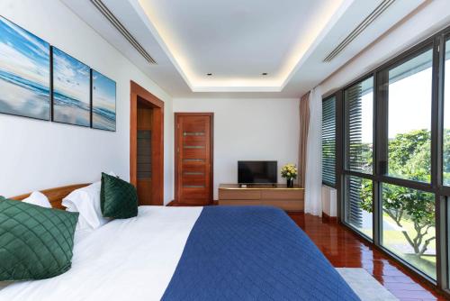 Ένα ή περισσότερα κρεβάτια σε δωμάτιο στο Ocean Sunny Villas Da Nang