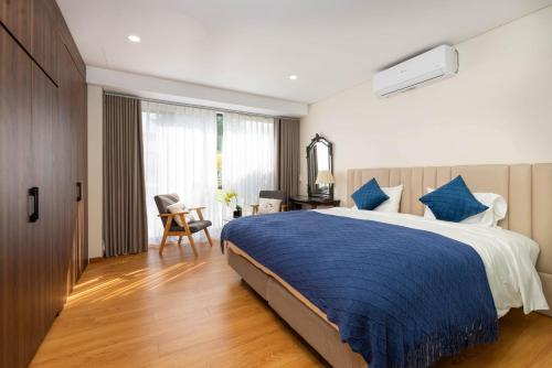 Ένα ή περισσότερα κρεβάτια σε δωμάτιο στο Ocean Sunny Villas Da Nang