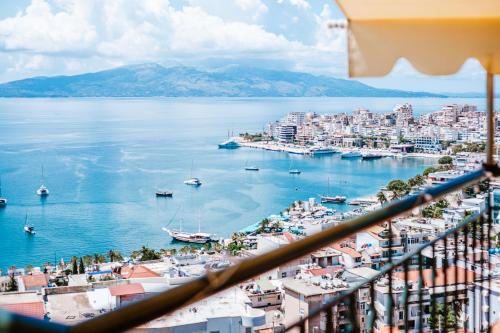 a view of a harbor from a balcony at Lost At Sea in Sarandë
