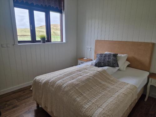 Letto o letti in una camera di Sólheimahjáleiga Guesthouse