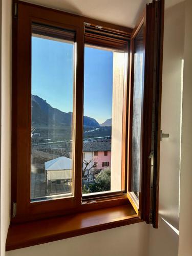 a window with a view of a mountain at Appartamento CS in Sabbionara
