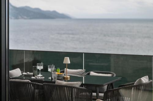 a table and chairs with a view of the ocean at Villa Laganini Apartment 2&4 in Podaca