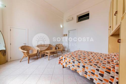 Ένα ή περισσότερα κρεβάτια σε δωμάτιο στο Bellavista Flat- San Foca