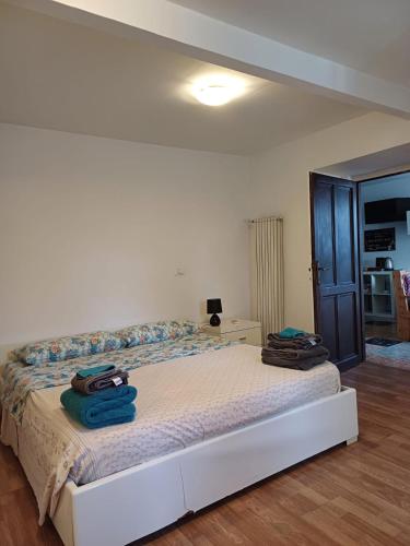 a bedroom with a bed with two bags on it at La casa sul farfa in Bocchignano