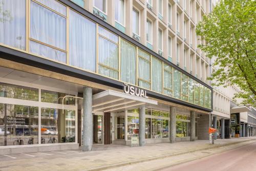 a building with a uska sign on the side of it at The Usual Rotterdam in Rotterdam