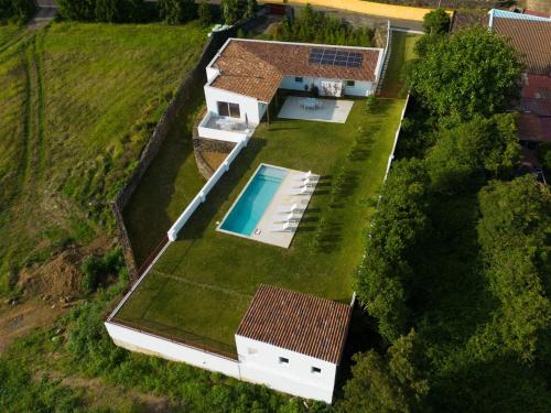 an aerial view of a house with a swimming pool at Casa da Bela Vista (Piscina e Vista Mar) in Ponta Delgada