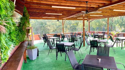 a group of tables and chairs on a patio at BSA Gradina Hotel & Aquapark - All Inclusive in Golden Sands