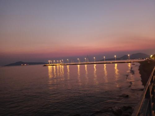 a bridge over a body of water at night at Seaview studio in Neapolis