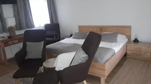 Ein Bett oder Betten in einem Zimmer der Unterkunft Fischerhof Appartements