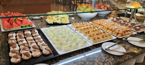 a buffet with many different types of pastries and fruit at Hotel Monarque Costa Narejos in Los Alcázares