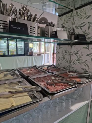 a buffet with many different types of food on display at Hotel Mistral in Alghero