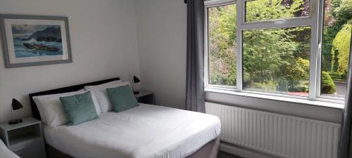 Ένα ή περισσότερα κρεβάτια σε δωμάτιο στο Riverfield Bed and Breakfast