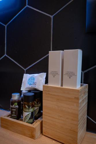 two wooden boxes filled with food on a table at Hotel Teuta in Sarandë