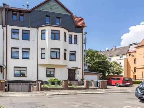 a white house with a black roof at Eichendorff Loft in Nordhausen