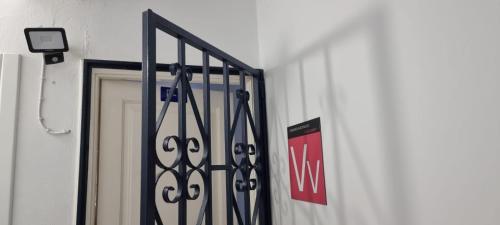 a door with a iron gate in front of a building at Lanzarote Apartment Rental Harbour View in Tías