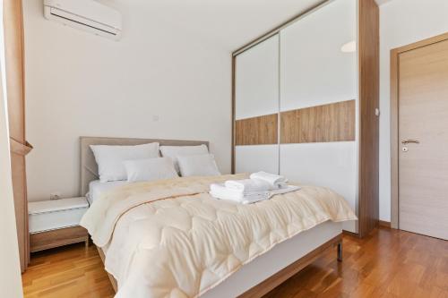 Ένα ή περισσότερα κρεβάτια σε δωμάτιο στο ID LUX APARTMENTS