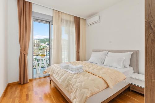 Ένα ή περισσότερα κρεβάτια σε δωμάτιο στο ID LUX APARTMENTS