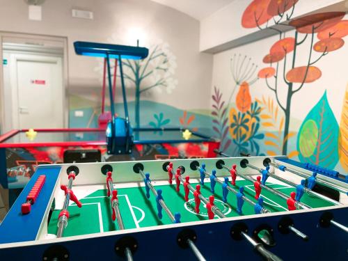 a childrens play room with a snooker table at Ostello Bello Roma Colosseo in Rome