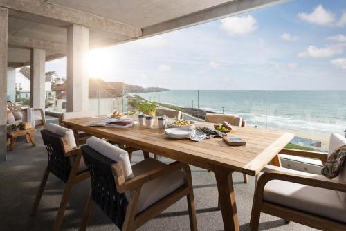 a dining room with a table and a view of the ocean at St Michaels The Liner in Falmouth