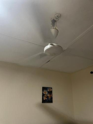 a ceiling with a light in a room at Villa de chez nous in North Legon