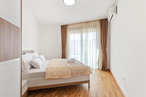 Ένα ή περισσότερα κρεβάτια σε δωμάτιο στο ID LUX APARTMENTS