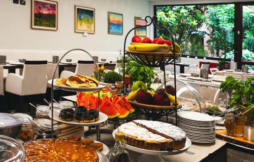 a buffet with many plates of food on a table at Hotel Villa Pannonia in Venice-Lido