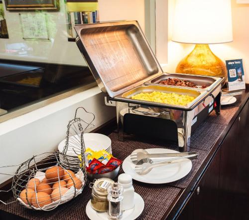 a buffet with food on a table in a hotel room at Hotel Villa Pannonia in Venice-Lido