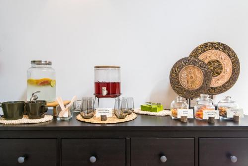 a counter with jars and glasses on a table at Hotel Ristorante Magia del Brenta in Fiesso dʼArtico