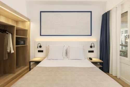 Letto o letti in una camera di Hotel Rovira