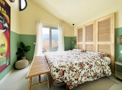 a bedroom with a bed and a window at Patio Canario * Beach Escape / 2 rooms, 2 terraces & pool in Arona