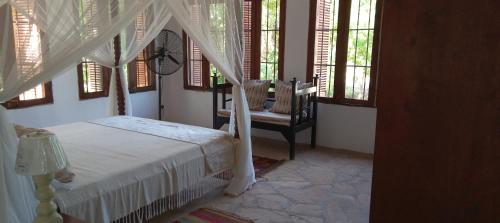 Ένα ή περισσότερα κρεβάτια σε δωμάτιο στο Villa Palma