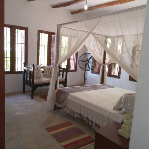 Ένα ή περισσότερα κρεβάτια σε δωμάτιο στο Villa Palma