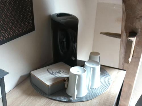 a glass table with two white objects on it at A 2 pas d AZAY in Neuil