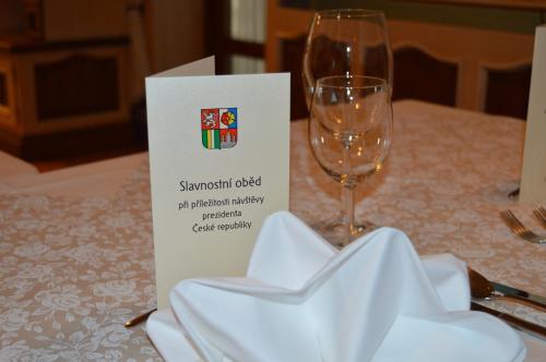 a wine glass sitting on top of a table at Hotel Maxant in Frymburk