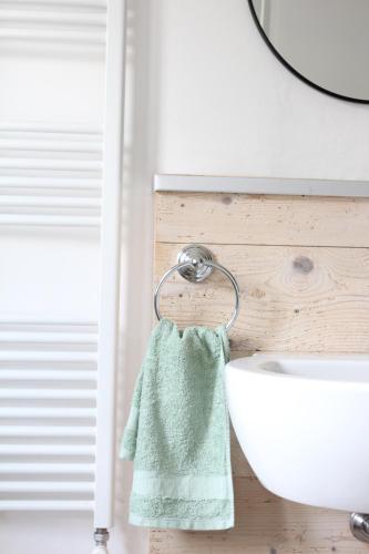 a towel hanging on a towel rack next to a sink at Casa Clarita - in centro storico in Marostica