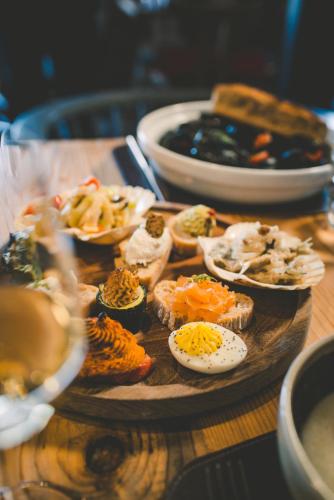 a wooden table with a plate of eggs and bread at Hilton Molino Stucky Venice in Venice