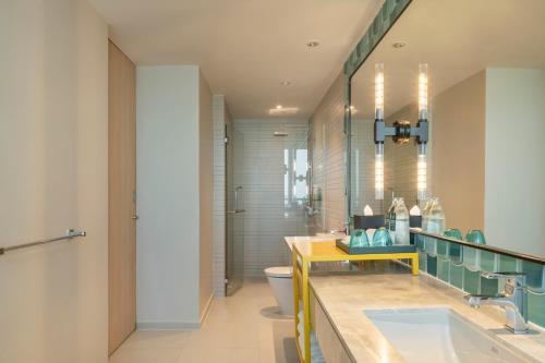 a bathroom with a sink and a toilet at Holiday Inn Pattaya by IHG in Pattaya Central