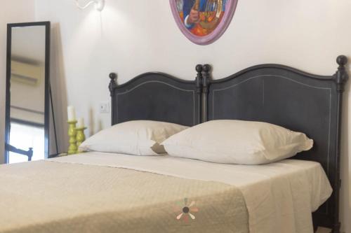 Postel nebo postele na pokoji v ubytování Agriturismo tenuta Margherita