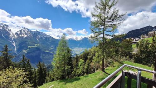 a view from a balcony of a mountain valley at Haus Bella Vista in Riederalp