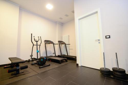 a gym with several exercise bikes in a room at Attico Centro con terrazza e jacuzzi e parcheggio privati in Genova