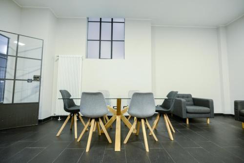 a conference room with a table and chairs at Attico Centro con terrazza e jacuzzi e parcheggio privati in Genova